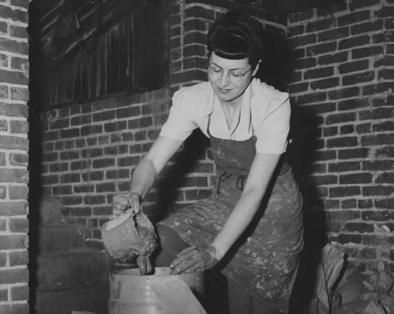 Gertrud pouring clay